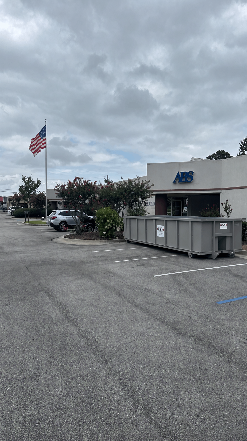 Elite Sanitation dumpster at a commercial location