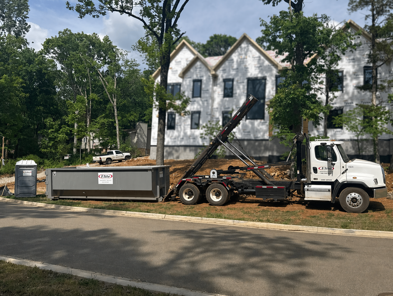 Dumpster and porta-potty at a new home construction site